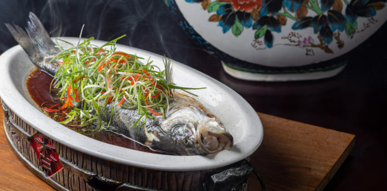 baked sea bass with ginger and spring onion